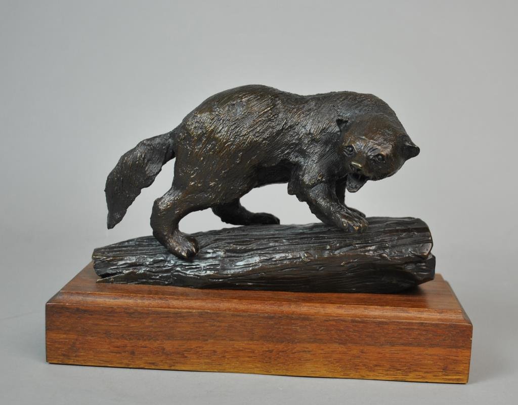 GARY HERBERT (American, 1934-2006): ‘Wolverine’, snarling and standing on a log, bronze sculpture, signed and numbered on log verso, ‘1978 Gary E Herbert 37/250’, 5x8.5x4.5in.