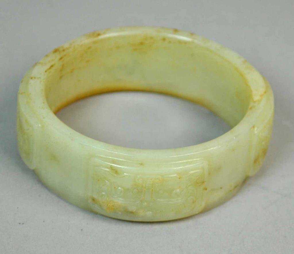 CHINESE CARVED CELADON JADE BANGLE (1 of 3)