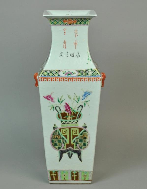 CHINESE FAMILLE ROSE SQUARE VASE: enamel decorated with planters, florals, and allover calligraphy, beast head and ring handles, small chip to one beast nose, 17in.