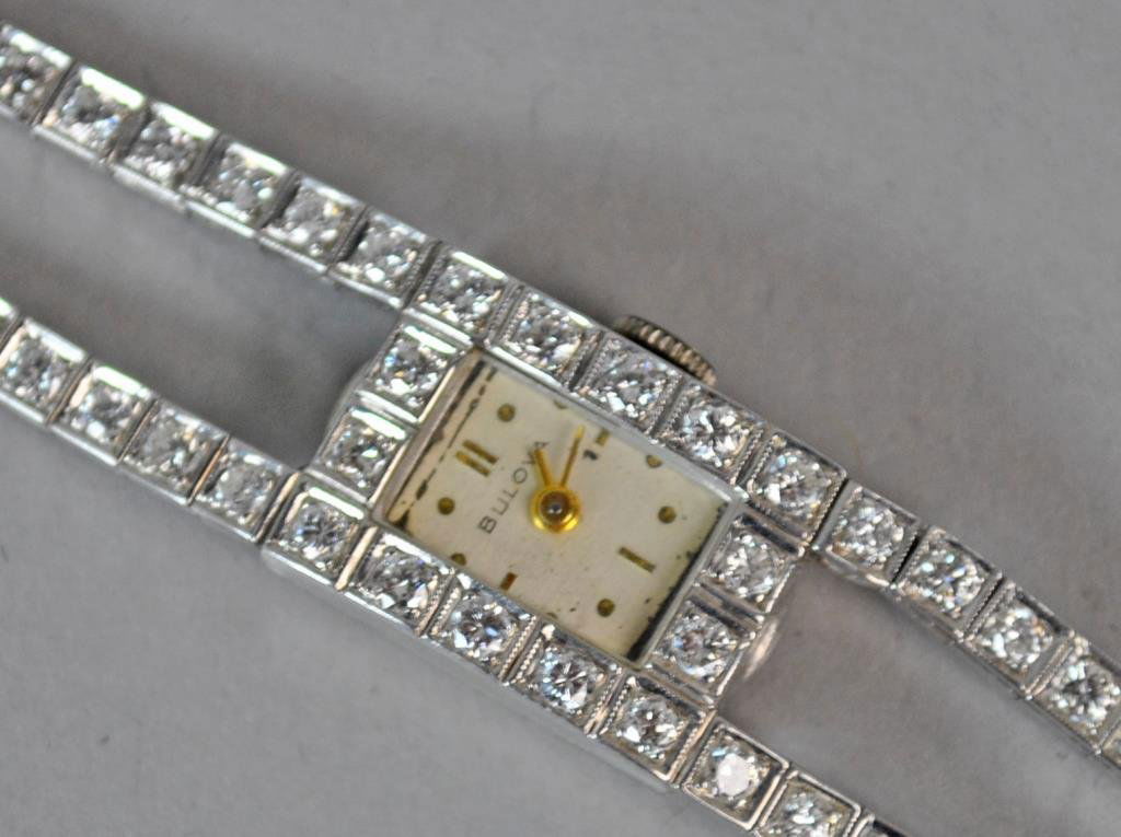 LAIDIES BULOVA GOLD & DIAMOND BRACELET WATCH (1 of 3)