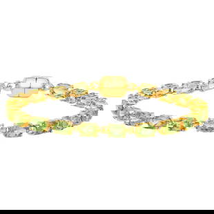 Peridot Tennis Bracelet 9.03 Carats 18K Yellow Gold Plated Sterling Silver: Accompanied by Gemological Appraisal by GIA GG/AJP Appraised value: $700 All gemstones are natural in origin 21 Peridots = 9.03 ct Metal: 18K Yellow Gold Plated Sterling Silver Length: 7 Inches - Comp