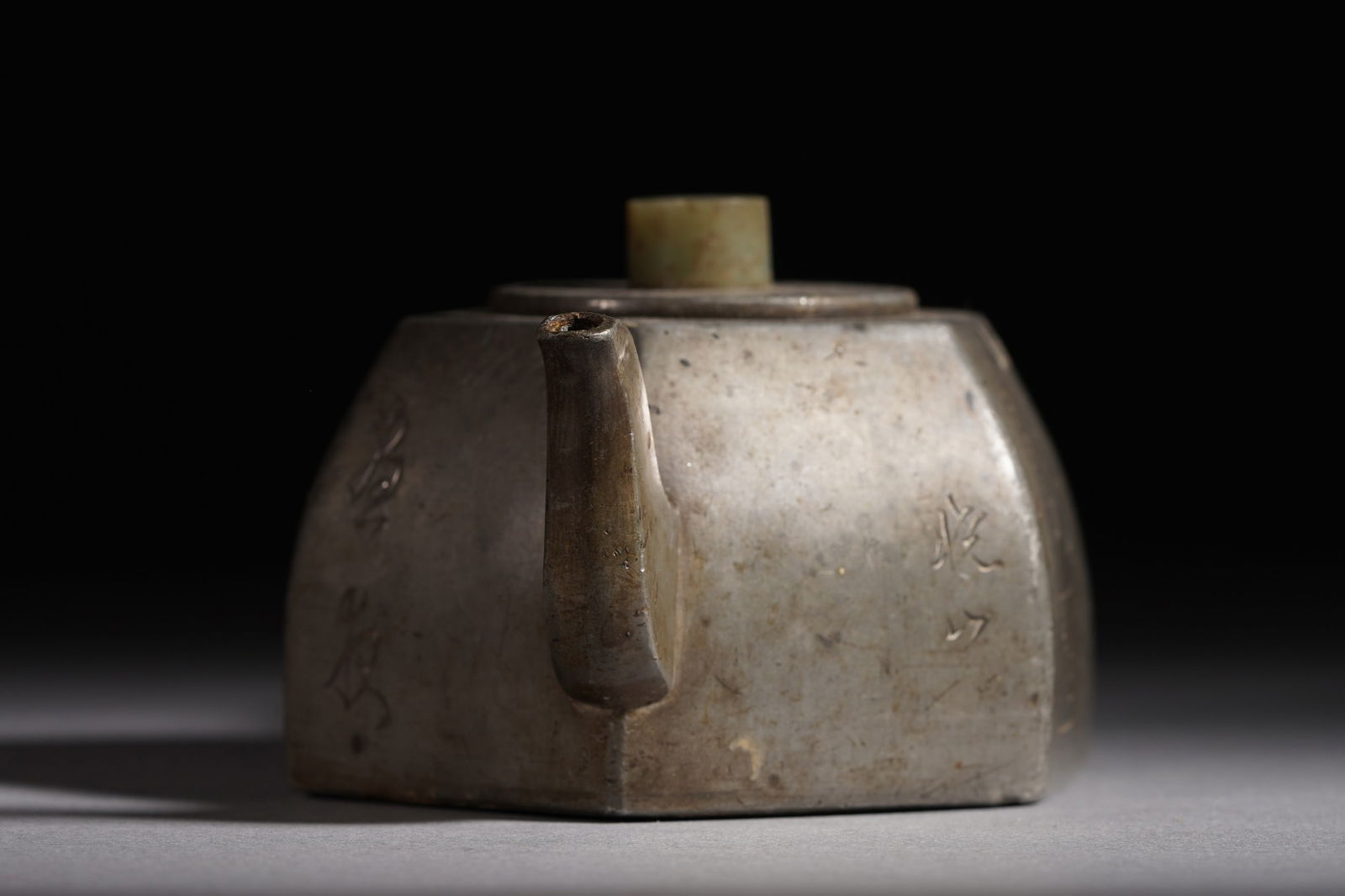 Inside: A hexagonal jade elephant inlaid with a pewter wrapped old teapot: Inside: A hexagonal jade elephant inlaid with a pewter wrapped old teapot