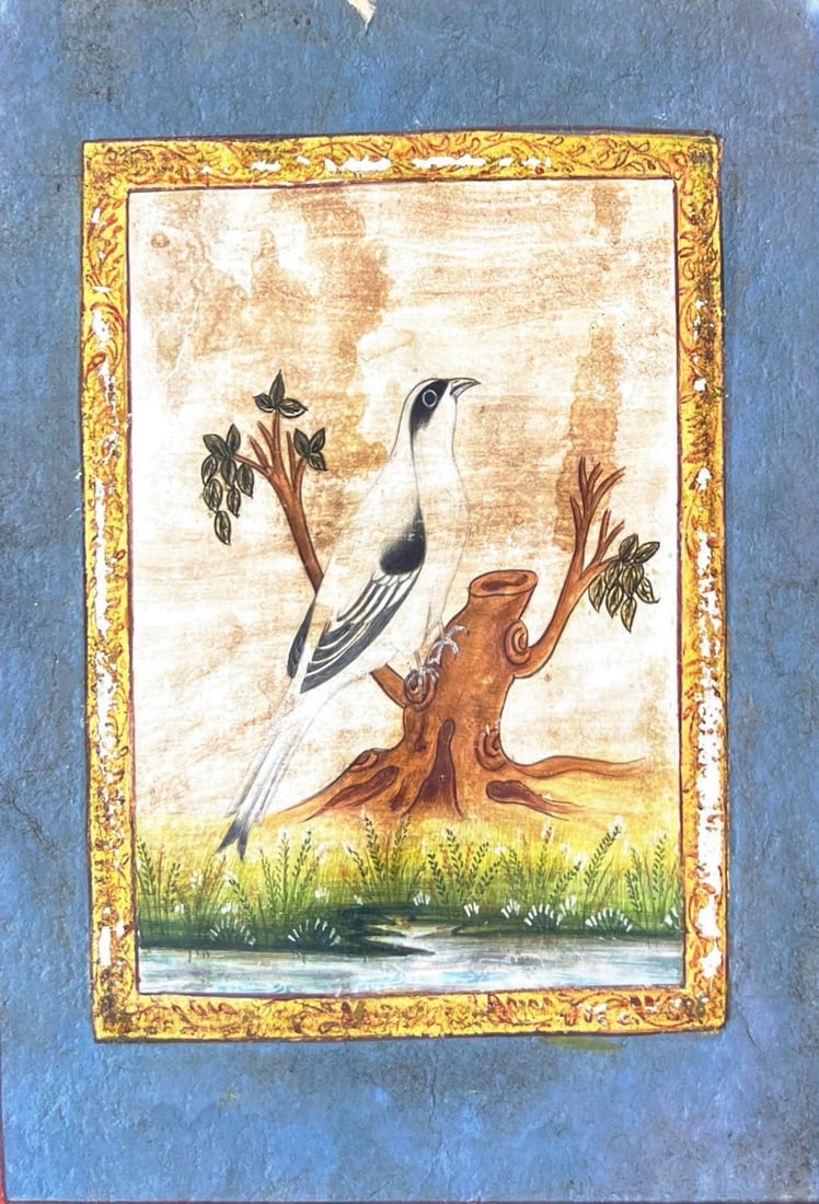 MUGHAL-ERA MINIATURE OF A PERCHED WHITE BIRD: MUGHAL-ERA MINIATURE OF A PERCHED WHITE BIRDA FINE EXAMPLE OF INDIAN MINIATURE PAINTING, THIS ARTWORK SHOWS A DELICATELY RENDERED WHITE BIRD WITH BLACK MARKINGS, ELEGANTLY PERCHED ON A TREE STUMP AMID