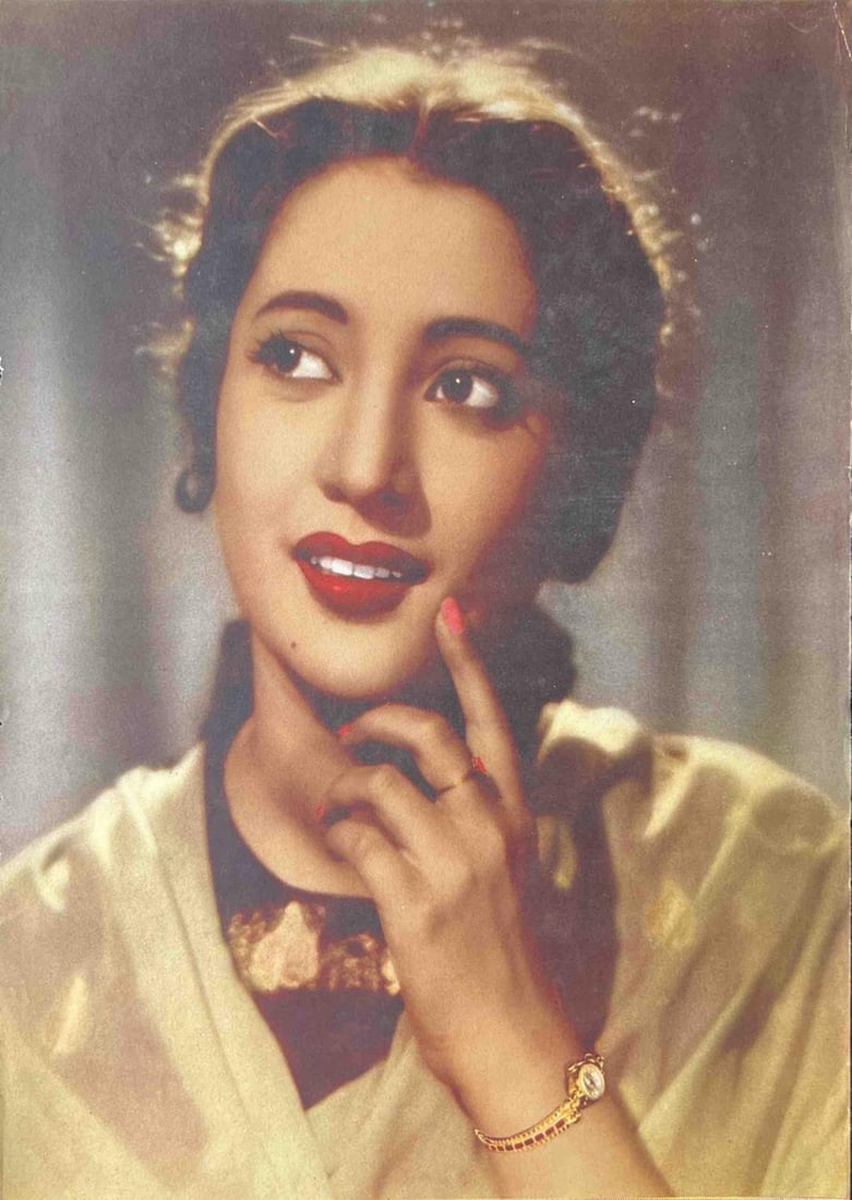 VINTAGE PORTRAIT OF AN ELEGANT WOMAN – GOLDEN AGE OF INDIAN CINEMA - PRINT: VINTAGE PORTRAIT OF AN ELEGANT WOMAN – GOLDEN AGE OF INDIAN CINEMA - PRINTTHIS GLOWING HAND-COLORED STUDIO PORTRAIT CAPTURES A GRACEFUL WOMAN FROM THE MID-20TH CENTURY, LIKELY AN ACTRESS FROM THE GO