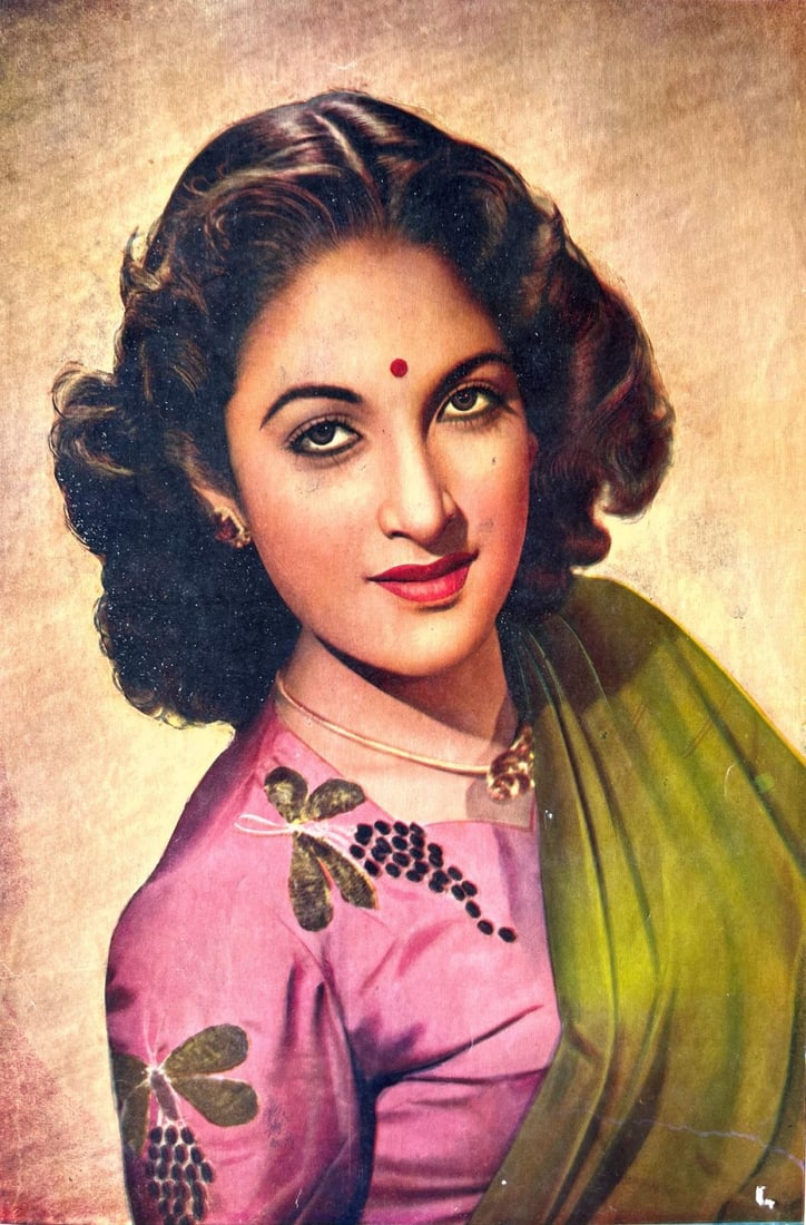 VINTAGE PORTRAIT OF AN INDIAN WOMAN IN SAREE - PRINT: VINTAGE PORTRAIT OF AN INDIAN WOMAN IN SAREE - PRINTTHIS HAND-COLORED STUDIO-STYLE IMAGE FEATURES A GRACEFUL INDIAN WOMAN WEARING A GREEN SAREE WITH A PINK BLOUSE ADORNED WITH EMBROIDERED GRAPEVINE MO