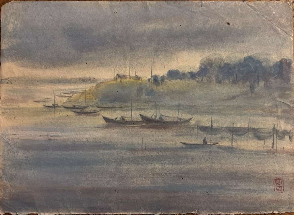 INDRA DUGAR (1918-1989) | UNTITLED | WATERCOLOR AND INK ON PAPER | EARLY TO MID-20TH CENTURY: AN ATMOSPHERIC EAST ASIAN WATERCOLOR AND INK LANDSCAPE PAINTING DEPICTING A MISTY RIVER OR LAKE SCENE, LIKELY JAPANESE. THE COMPOSITION FEATURES SEVERAL TRADITIONAL FISHING BOATS MOORED ALONG THE