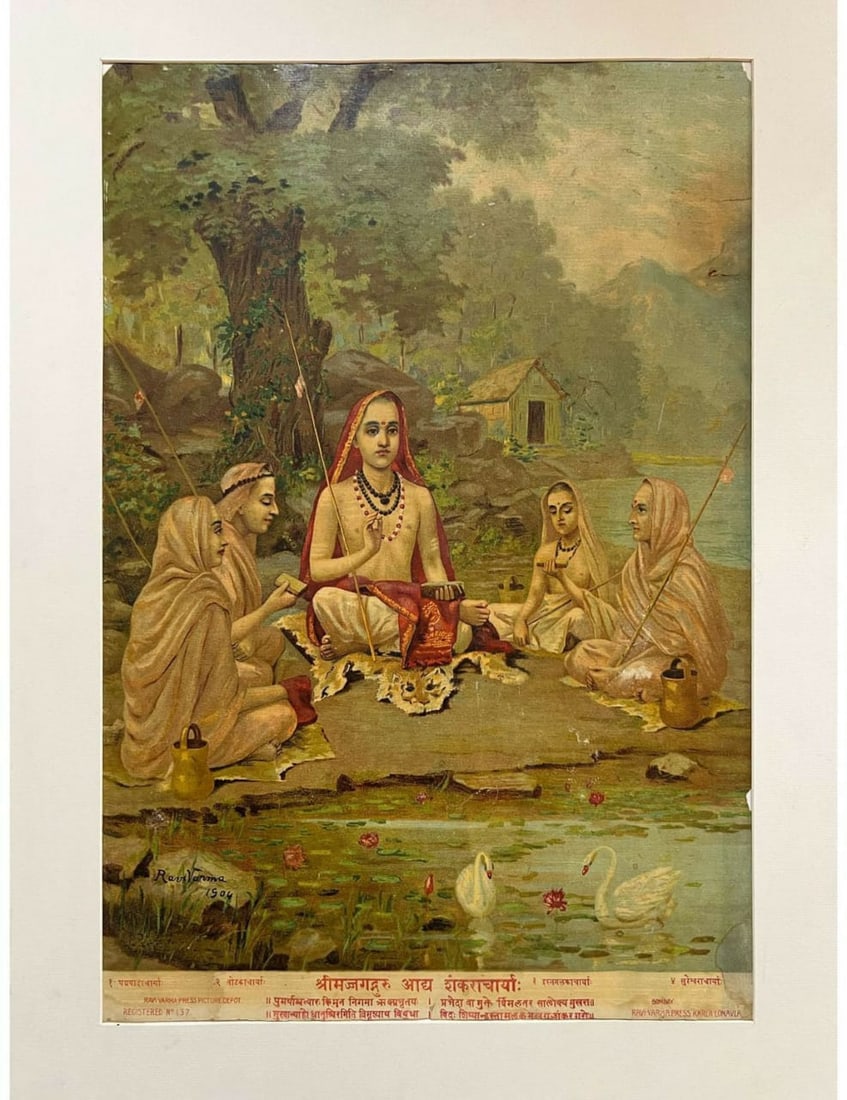RAJA RAVI VARMA – LITHOGRAPH PRINT DEPICTING A TRADITIONAL INDIAN SCENE: A LITHOGRAPH PRINT AFTER THE WORK OF RAJA RAVI VARMA (1848–1906), DEPICTING A FIGURATIVE SCENE SET WITHIN A LUSH, WOODED LANDSCAPE. THE CENTRAL FEMALE FIGURE IS SEATED PROMINENTLY, SURROUNDED BY