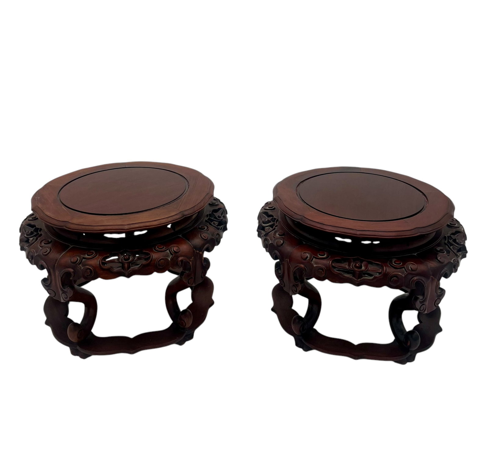 Pair of Asia Carved Rosewood Vase Stands: Pair of Asian carved rosewood vase stands.