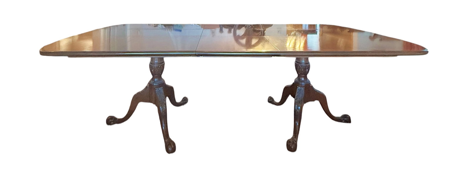 Mahogany Banquet Dinning Table: Ball and Claw two pedestal banquet table. Seats eight. Dimensions are with leaf installed. Leaf dimensions 5"H x 48"W x 19"D.