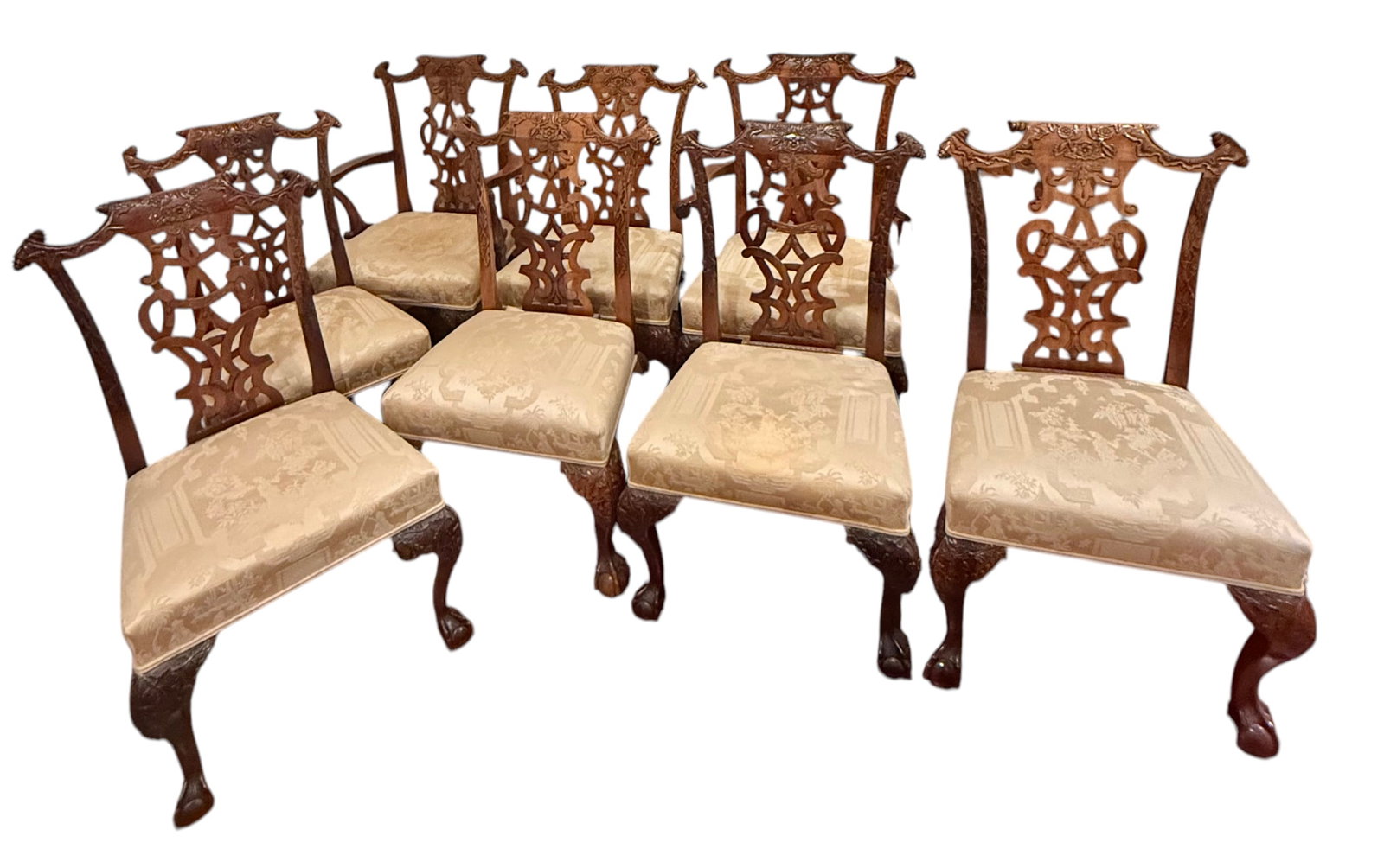 8 Chippendale Style Mahogany Chairs - Ball and Claw Feet - Nicely Carved: 2 Captain chairs and 6 regular chairs. Captain chair dimensions 40.5"H x 27"W x 24"D. Regular chairs 39"H x 24"W x 21"D.