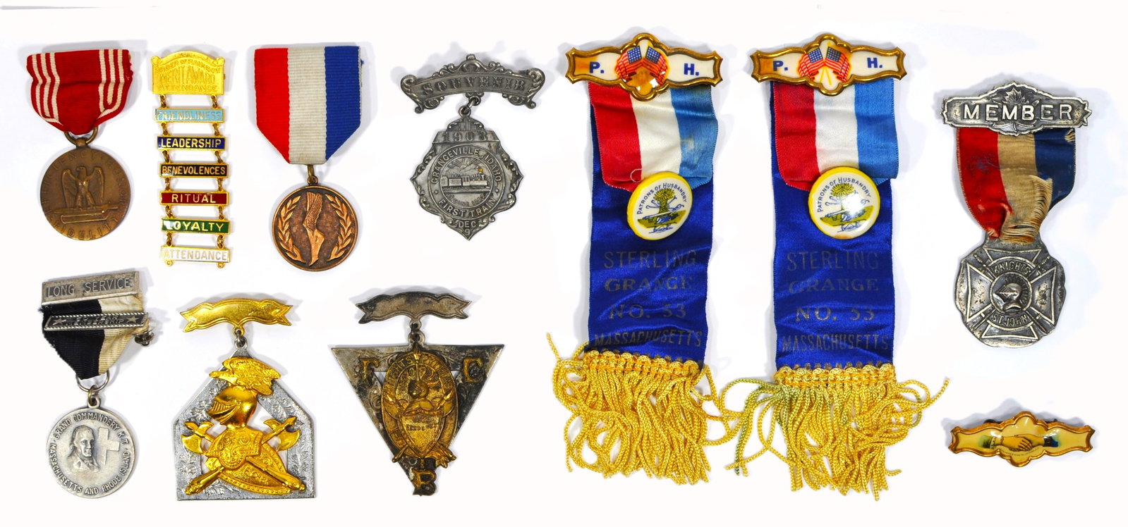 Lot of 11 US Fraternal & Patriotic Medals: Mixed lot of 11 antique and vintage fraternal and commemorative medals, badges, and ribbons from various U.S. organizations. Provenance: From a private New England collection.