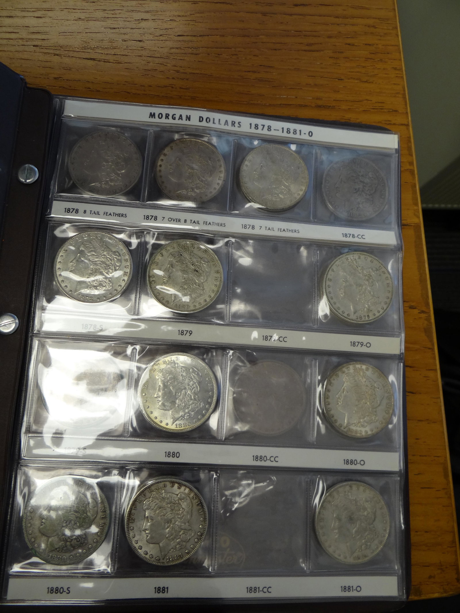 Albums: 1878 7TF-1921S Morgan $1.00 (48 pieces) partial: Albums: 1878 7TF-1921S Morgan $1.00 (48 pieces) partial set, Circulated except 1880, Uncirculated. In two albums