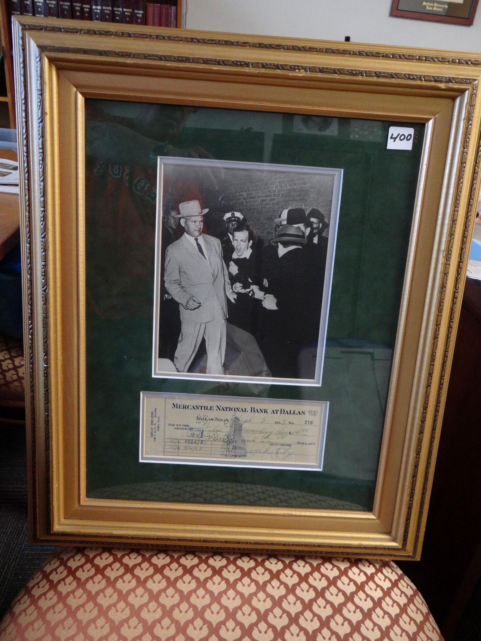 Framed Jack Ruby Photograph of Ruby Shooting Lee Harvey: Framed Jack Ruby Photograph of Ruby Shooting Lee Harvey Oswald (7" x 9") along with a September 1963 Check Signed by Jack Ruby (3" x 8").