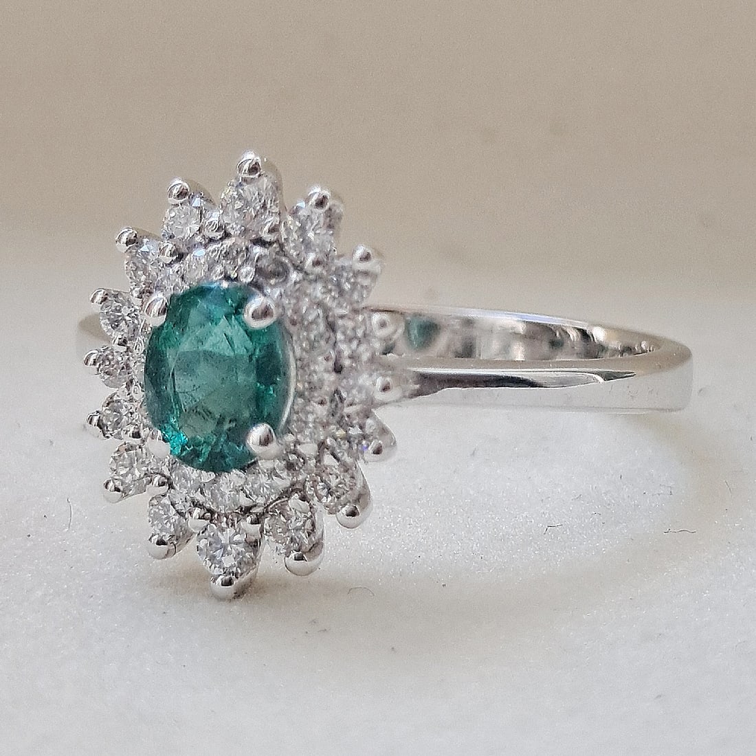 A stunning 0.44ct Emerald is set on a 18k Solid White Gold 3.06g Ring, full of 0.34ct Diamonds (1 of 2)