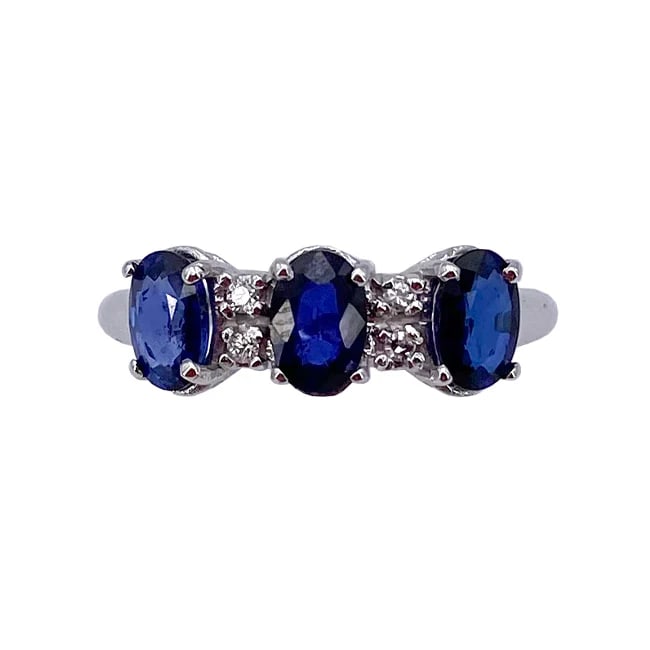 A row of 3 Sapphires 1.79ct total on this intense 18k Solid white gold ring with 0.04ct Diamonds ,: An intense18k white gold trilogy ring featuring three vivid oval-cut sapphires accented by brilliant diamonds. Crafted for timeless elegance and exceptional value, this classic design delivers