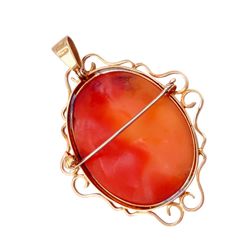 Retro 1970s Hand-Carved Carnelian Portrait Pendant-Brooch in 18k Yellow Gold, 12.81 g: A romantic retro pendant-brooch featuring a hand-carved portrait of a lady on carnelian shell, set within an exquisitely crafted 18k yellow gold frame. This artistic old-school piece combines