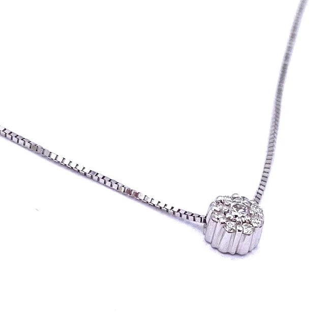 Timeless white gold 18kt pendant with diamond blossom sparkle 0.09ct total - weight 1.78 gr: Timeless white gold 18kt pendant showcasing a diamond blossom sparkle design with a subtle single-stone radiance effect, including an adjustable chain for 17.32" or 16.14" wear. Weight: 1.78 gr Pendan