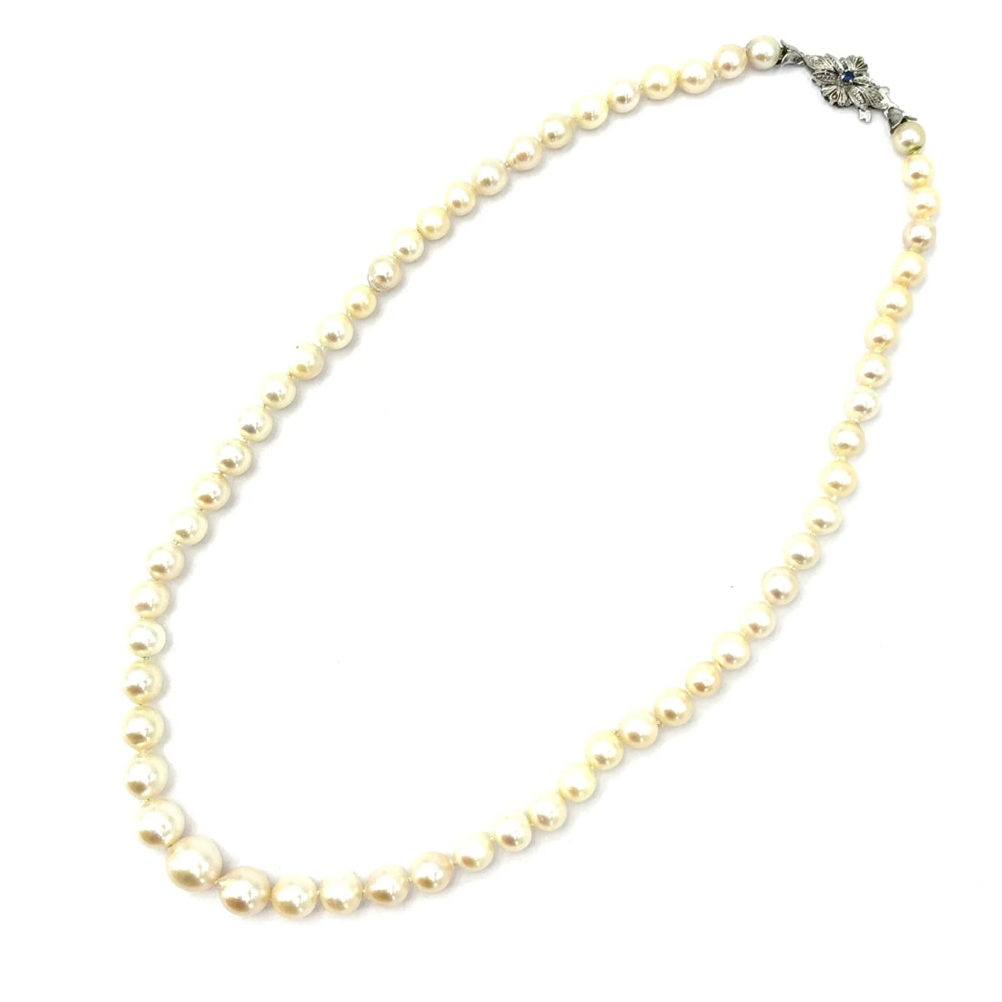 Retro-Style Akoya Pearl Necklace with 18k White Gold Clasp and 0.01 ct Sapphire Accent, meas. 16.54": Elegant choker-style necklace composed of graduated Japanese Akoya pearls with natural irregular character, completed by a refined 18k white gold clasp set with a delicate sapphire. Length 16.54" Japa