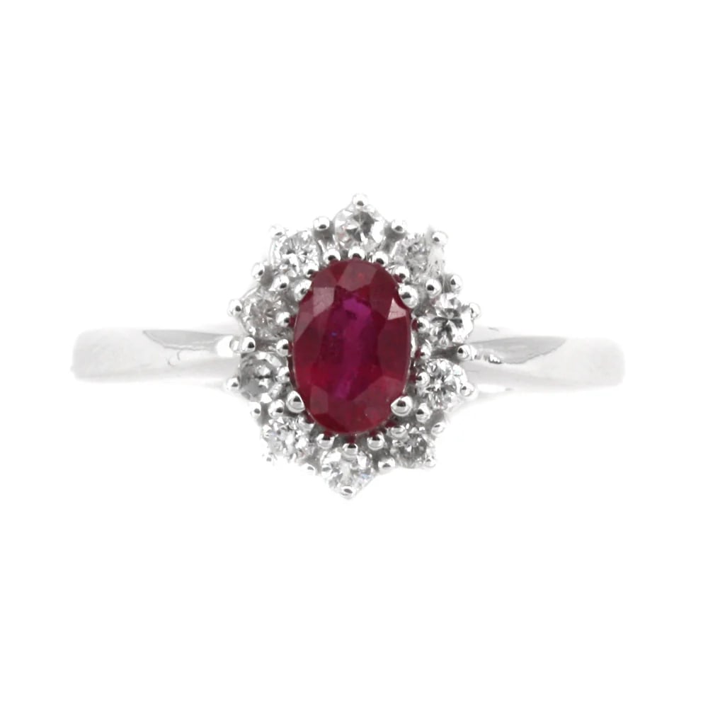 A 0.59ct Ruby is set on this timeless 18k White Gold Ring with 0.20ct Diamonds , 2.75 gr (1 of 3)