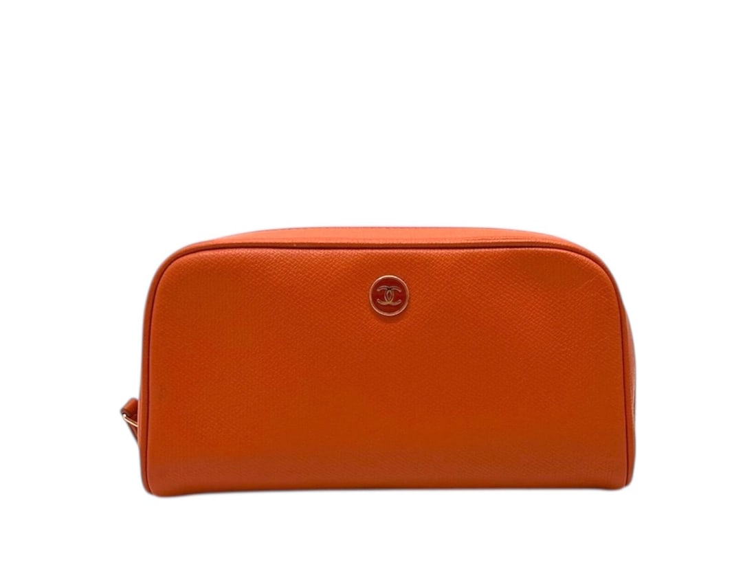 Chanel Orange Leather Trousse Gold Hardware - Vibrant & Chic: Delightful Chanel pouch crafted from vibrant orange leather for a sophisticated pop of color. Accented with gleaming gold hardware, this accessory combines practicality with the Maison?s timeless styl