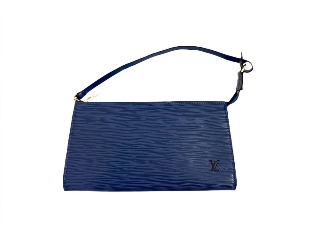 Louis Vuitton Blue Epi Leather Pochette Accessoires - Sophisticated & Vibrant: Distinguished Louis Vuitton Pochette Accessoires crafted from textured Epi leather in a vibrant blue hue. Highlighted by gleaming gold hardware, this accessory exudes a structured and polished eleganc