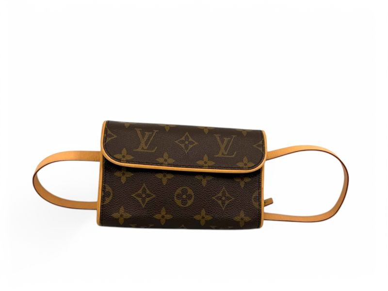 Louis Vuitton Florentine Monogram Pochette - Iconic: The exquisite Louis Vuitton Florentine pochette, a masterpiece of versatility that can be styled as a belt bag or a sophisticated clutch. Crafted from signature Monogram canvas with natural cowhide tr