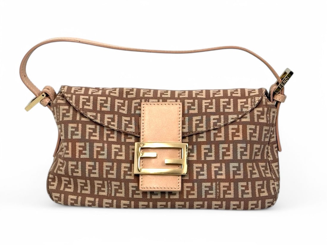 Fendi Baguette Beige Canvas - Sophisticated Icon: Fendi Baguette, an icon of fashion history that continues to define sophisticated luxury. This version in refined beige fabric with gold hardware offers a subtle yet commanding presence, perfect for d