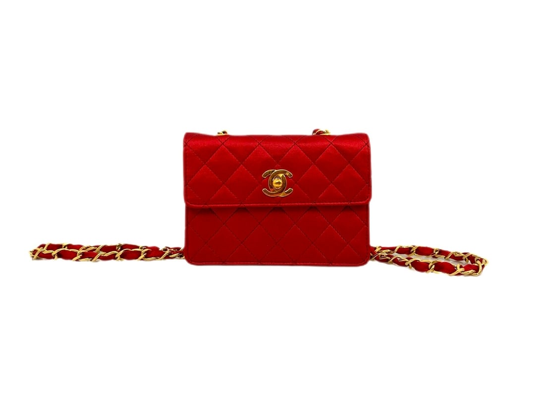 Extraordinary 1988 Chanel Red Silk Mini Crossbody: An extraordinary 1988 Chanel mini crossbody, masterfully crafted from sumptuous red silk for a dazzling evening presence. Adorned with opulent gold hardware, this rare accessory represents the ultimat