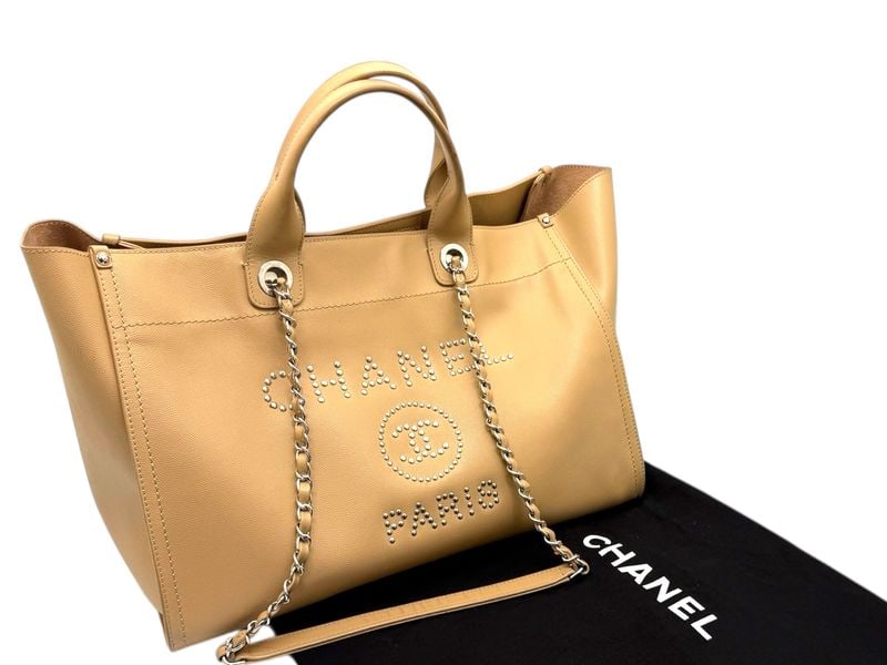 Chanel Deauville Beige Leather Tote - Grand & Radiant Riviera Luxury: The majestic Chanel Deauville tote, masterfully crafted in supple beige leather for a look of absolute Riviera sophistication. Adorned with polished silver hardware and the iconic bold logo, its grand