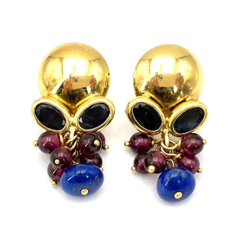 Artistic 18kt Yellow Gold Vintage Drop Earrings with 0.79ct Oval Sapphire, Garnet & Lapis Cluster, 5: Artistic 18kt yellow gold vintage drop earrings featuring circular studs at the lobes, adorned with a sparkling oval sapphire centerpiece and playful clusters of garnet and lapis stones. With a post a