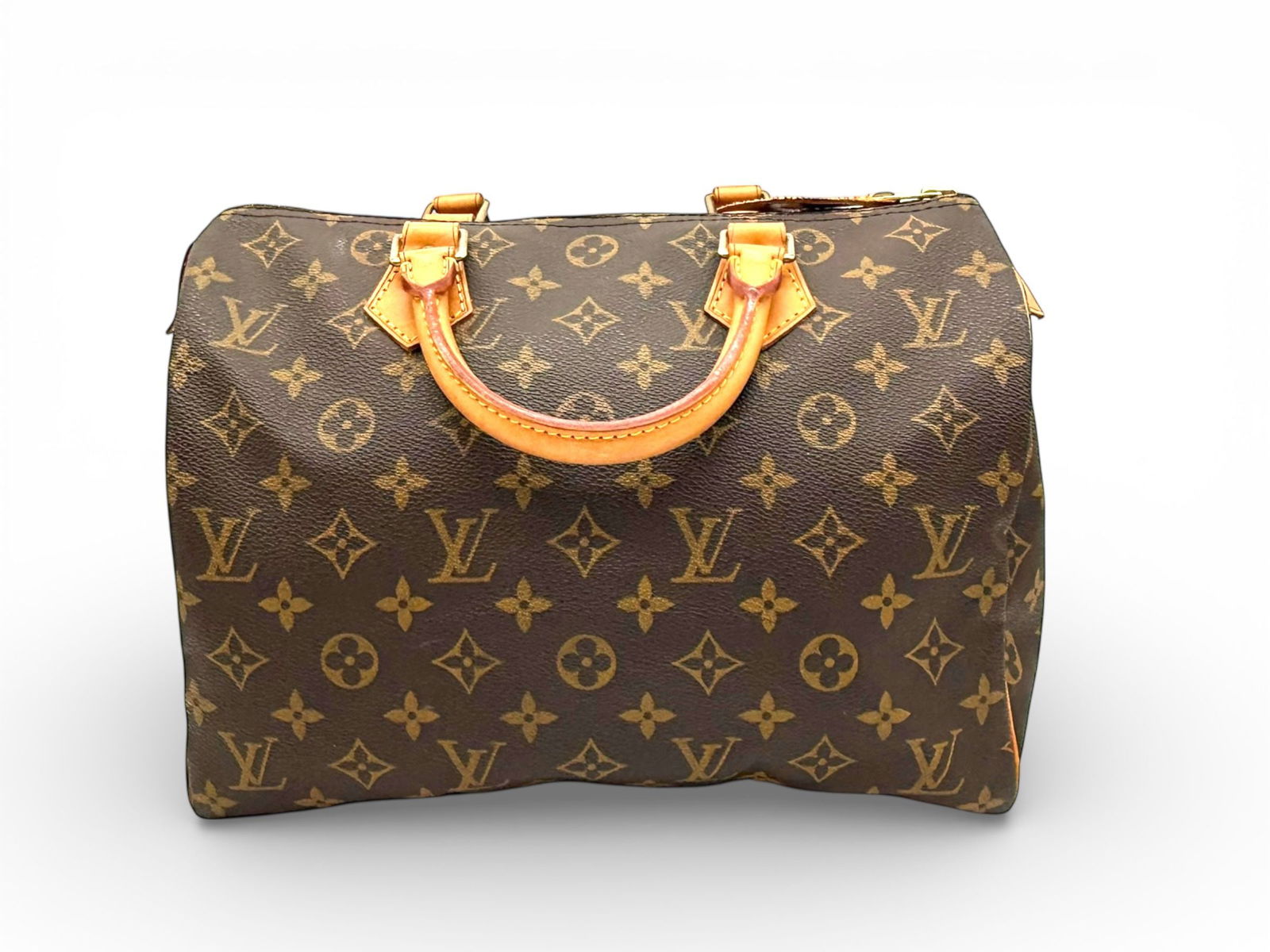 Iconic Louis Vuitton Speedy 30 - Timeless Monogram Elegance: An enduring symbol of refined travel and everyday sophistication, this Louis Vuitton Speedy 30 captures the essence of classic Parisian luxury in its most iconic form. Crafted in the unmistakable Mono
