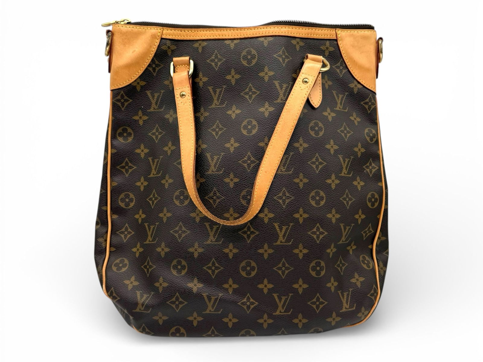Louis Vuitton Odeon GM - Elegant Monogram Shoulder Bag with Chic Gold Accents: The Louis Vuitton Odeon GM exudes sophisticated charm and versatile elegance Crafted in classic Monogram coated canvas with natural cowhide leather, featuring a stylish shoulder design with detachable