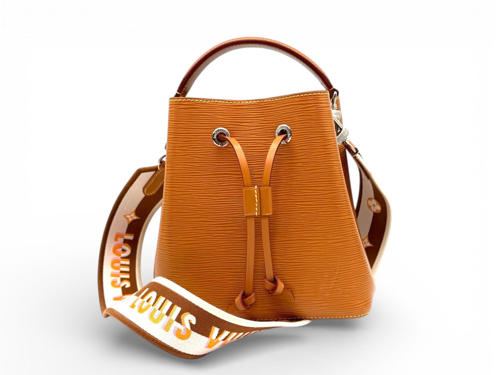 Louis Vuitton Neo Noe BB Epi - Chic Mustard Shoulder Bag with Sleek Silver Hardware: The Louis Vuitton Neo Noe BB Epi exudes modern elegance and vibrant style Crafted in luxurious Epi leather with silver hardware, a compact and stylish shoulder bag perfect for everyday sophistication