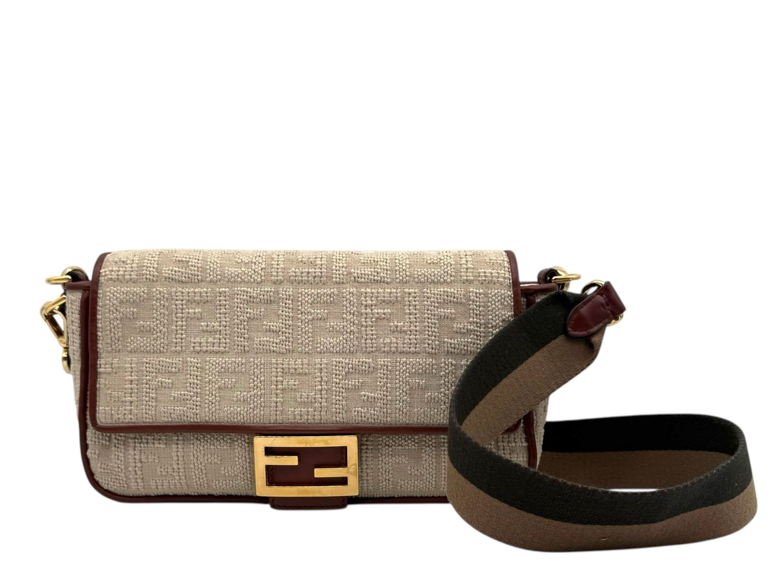 Fendi Baguette Elegant Fabric Shoulder Bag in Soft Beige with Gold Hardware: Discover the timeless charm of the Fendi Baguette, a sophisticated fabric shoulder bag that elevates any outfit with effortless style. Brand: Fendi Type: Shoulder Bag Material: Fabric Color: Beige / L