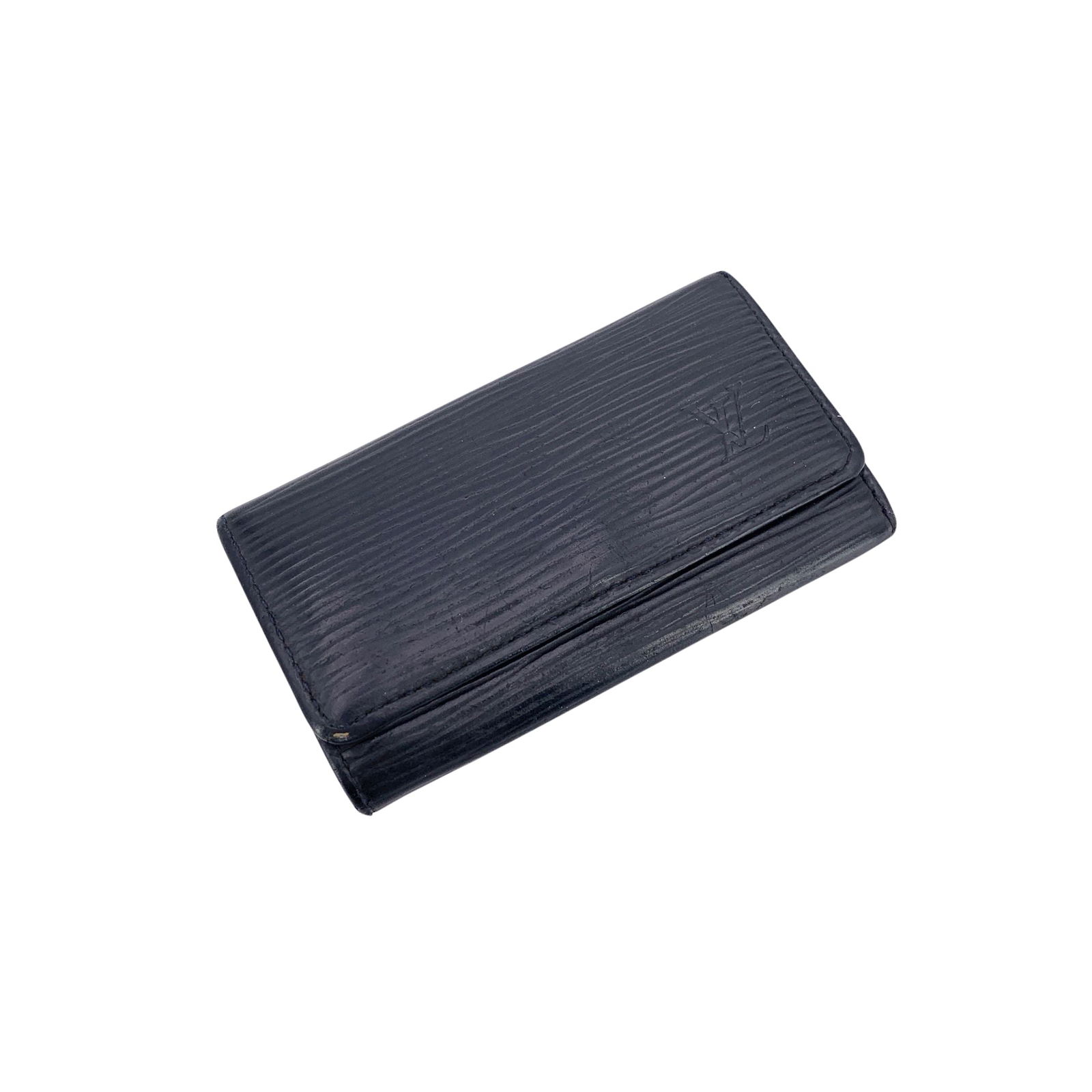 Louis Vuitton Leather Accessory: This elegant Louis Vuitton key case is crafted in durable black Epi leather and finished with a front snap closure for secure, easy access. The interior features a smooth leather lining and four key r
