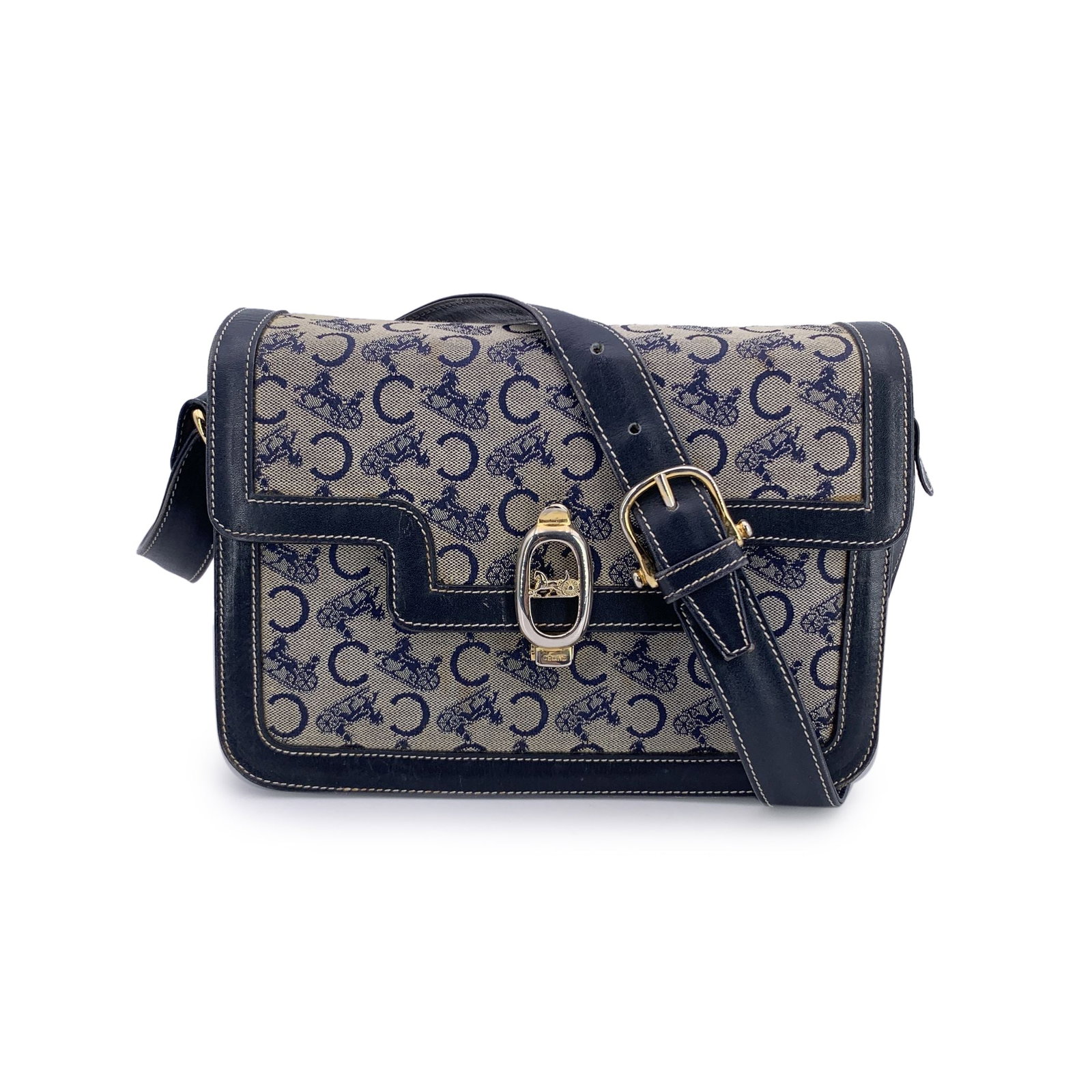 Celine Vintage Cloth Shoulder Bag Clasp box: Elegant and quietly iconic, this vintage C Carriage box shoulder bag from Celine captures the understated luxury of a bygone era. Crafted in the classic grey Carriage C canvas and framed with navy blu