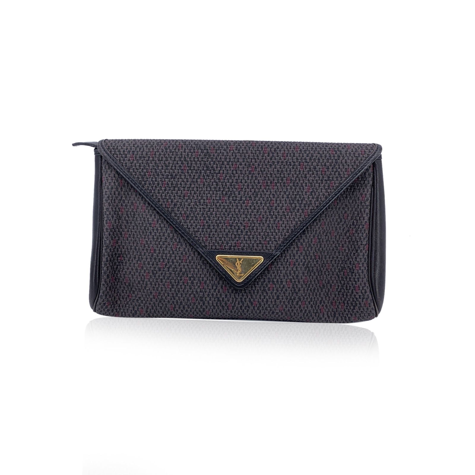 Yves Saint Laurent Vintage Cloth Clutch Bag: Chic and timeless, this vintage Yves Saint Laurent clutch is a refined statement of understated luxury. Crafted from grey textured vinyl canvas with black leather trim, it effortlessly balances classi