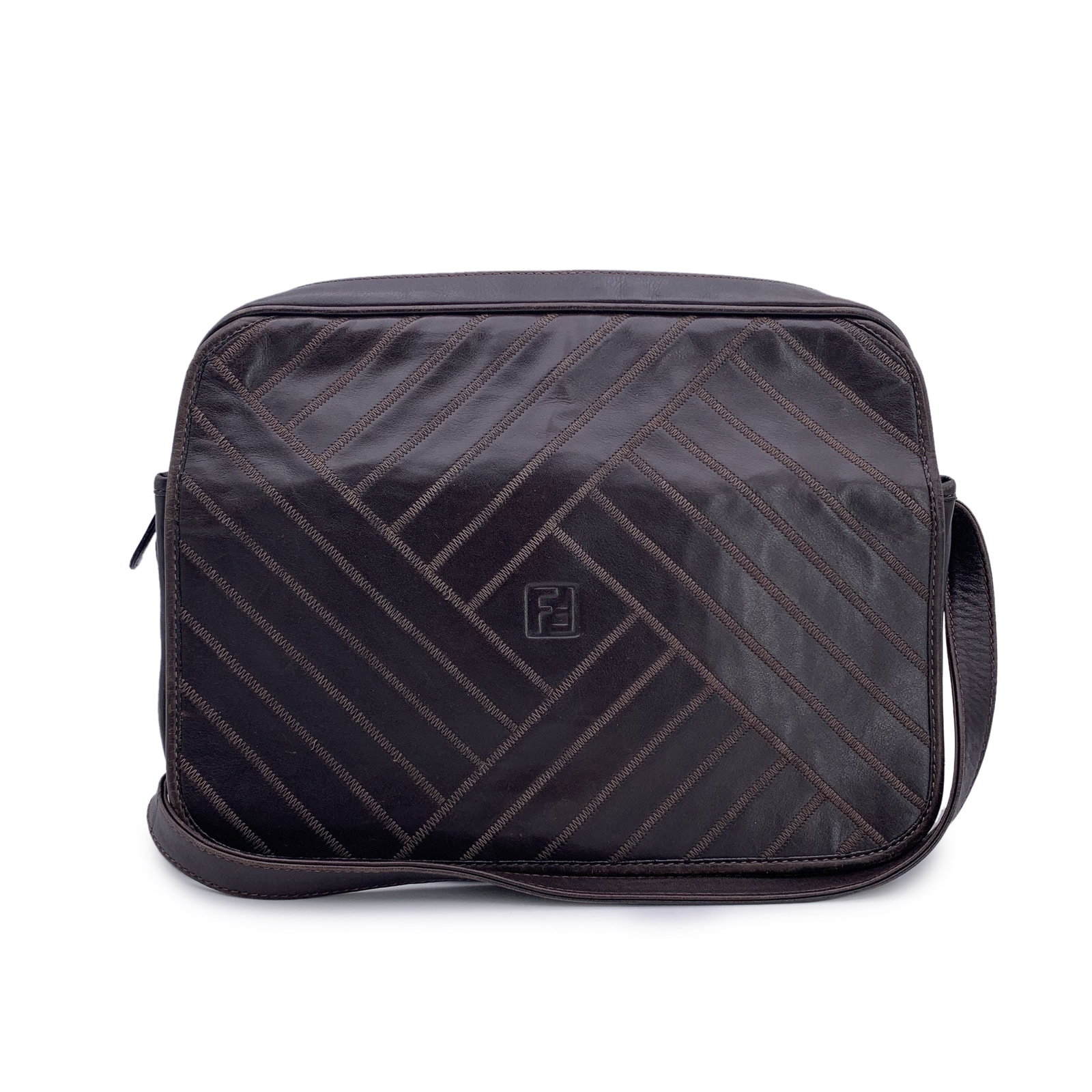 Fendi Vintage Leather Crossbody Bag FF: Vintage Fendi messenger bag crafted indark brown leather with stitching detailing on the flap. Upper zipper closure. Front compartment with flap and magnetic button closure on the front. Brown leather