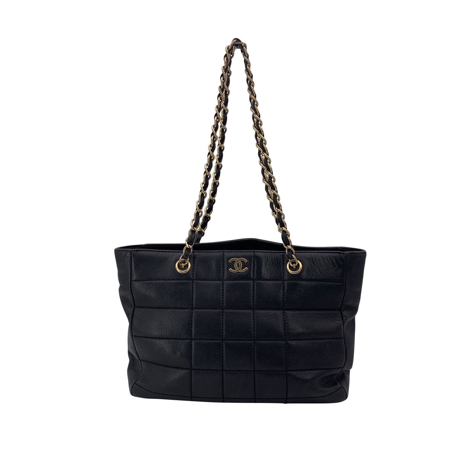 Chanel Leather Tote Bag: Step into timeless elegance with this Chanel Black Leather Chocolate Bar Tote Shoulder Bag from the 2000s. Crafted in Italy, this medium-sized bag features the signature geometric Chocolate Bar quilti