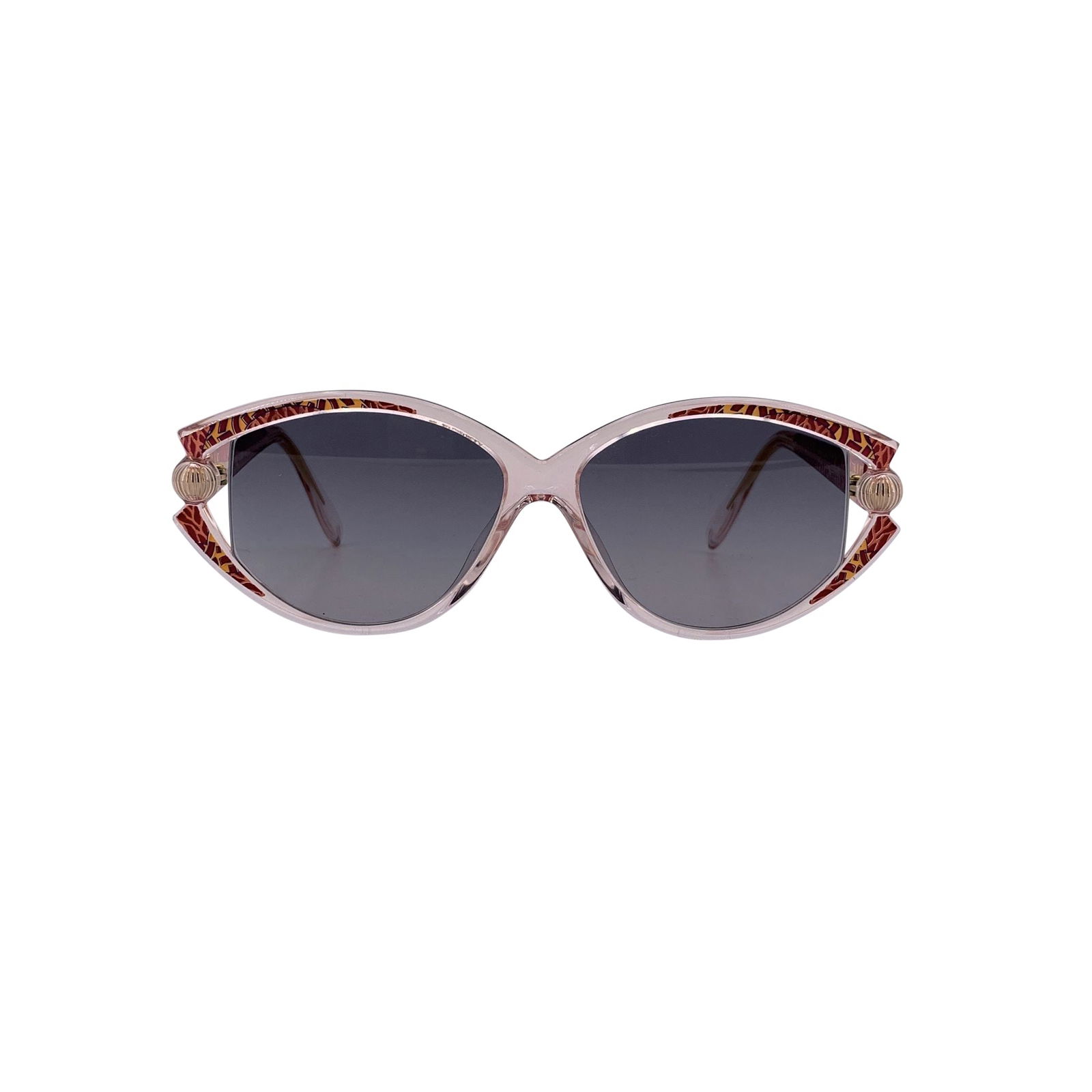 Silhouette Vintage Plastic Sunglasses: Step into the refined elegance of 1980s Austrian design with these Silhouette Vintage Oval Sunglasses M 1816/20 C2691. Their transparent front frame is adorned with a red motif streaked with light pin
