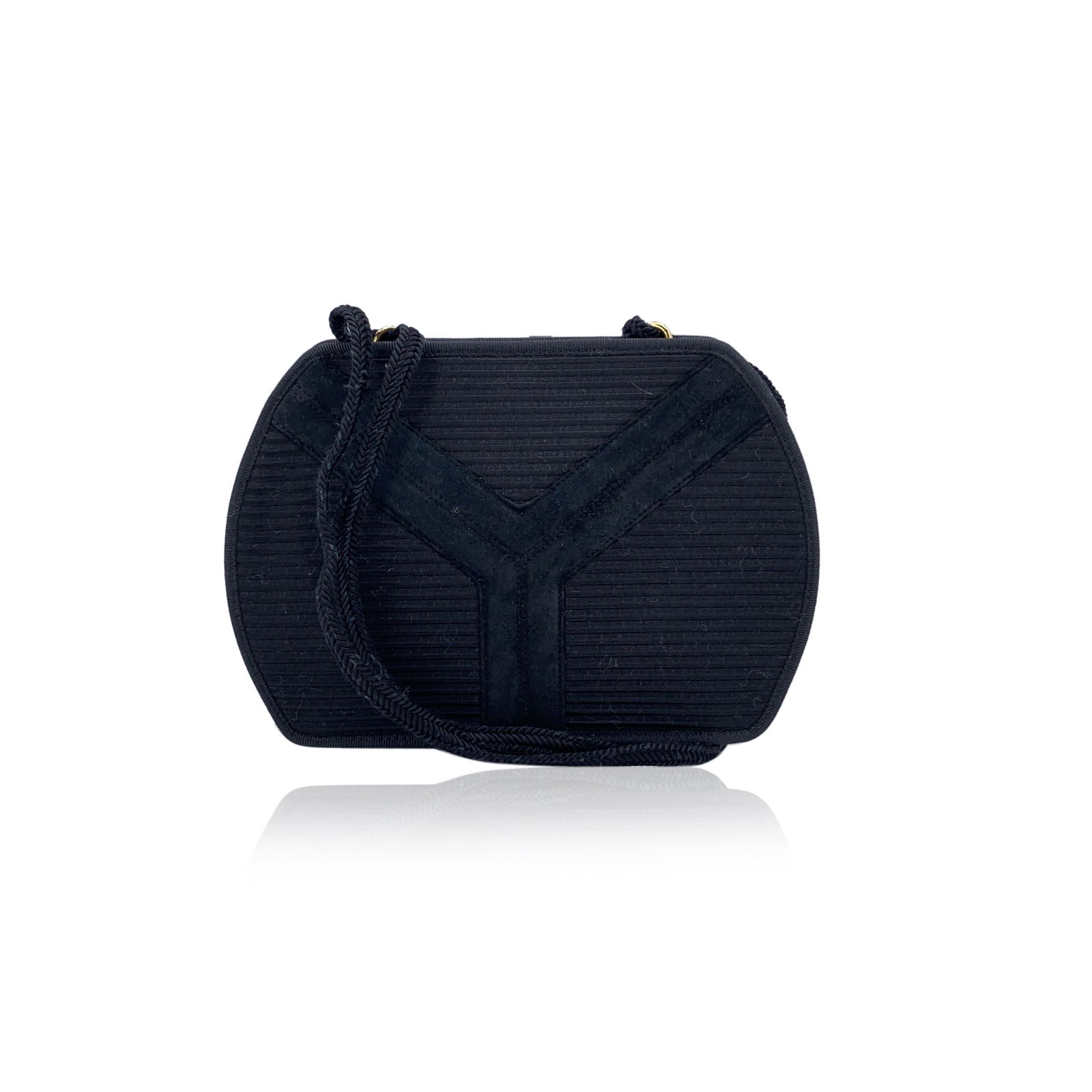 Yves Saint Laurent Vintage Cloth Shoulder Bag: A timeless piece from the golden era of understated elegance, this vintage Yves Saint Laurent messenger bag captures the essence of quiet luxury. Crafted in rich black ribbed fabric, the bag features