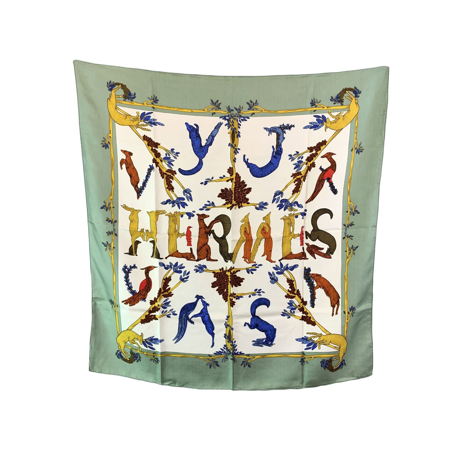 Hermes Vintage Silk Scarf Carre 90: A rare treasure for the true Hermes devotee, this vintage "Alphabet III" scarf captures the whimsical artistry of designer Annie Faivre, first released in 1990 and never reissued. Across a rich brown