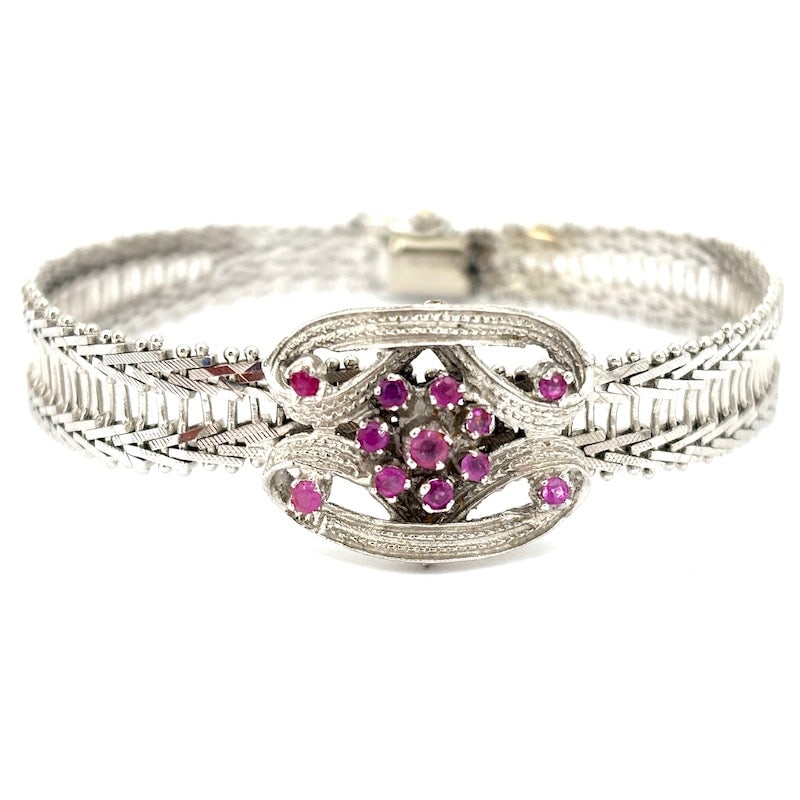 1950s bracelet white gold and rubies; 23.47 gr.: Lovely one-of-a-kind vintage bracelet small goldsmith masterpiece, 18k white gold with central decorative insert with 40-50 ruby dots. Bracelet can be opened, with 8 security. An exquisitely poetic