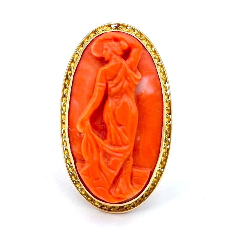 Vintage signed coral cameo ring and yellow gold; 14.18 gr.: Artistic and impressive vintage yellow gold ring with an enchanting sculpted cameo signed by master R. Panariello, in natural salmon-colored coral framed in 18 kt gold (perimeter frame above) and moun