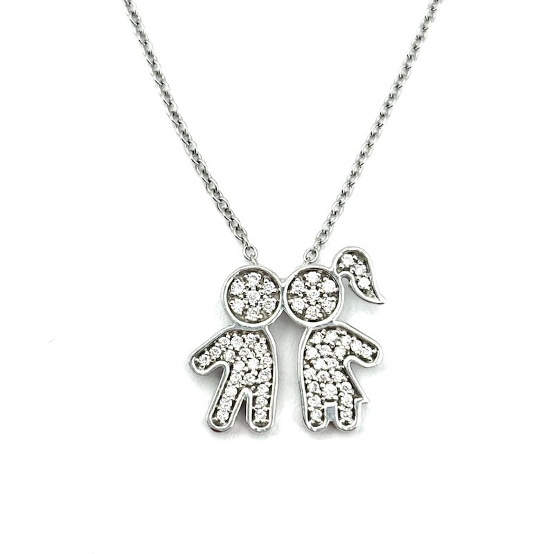 Brilliant baby boy and baby girl pendant in white gold; 5.82 gr.: Sweet baby pendant with baby boy and baby girl, in 18 kt white gold and diamonds. White gold chain included. The baby pendant measures 1.5 cm x 1.6 cm. The world's greatest love made jewelry! Our comp