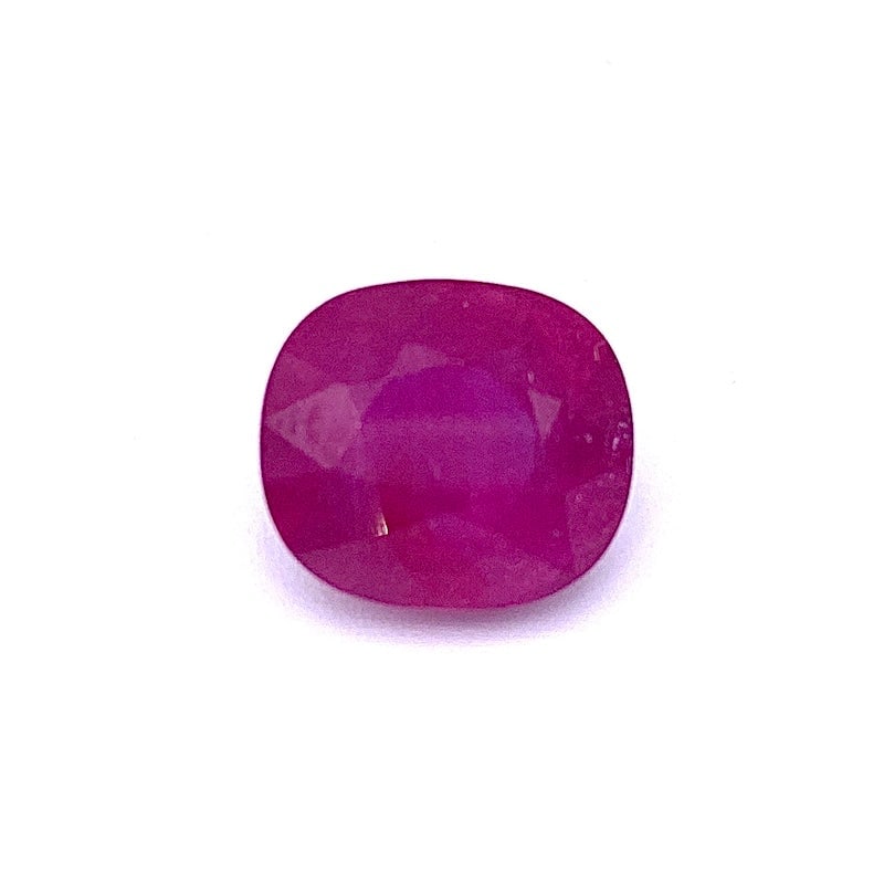 Ruby loose stone, cushion - 12.25 ct.: Exquisite loose cushion-cut ruby featuring rich faceted surfaces, highlighting the gem?s deep color and natural brilliance. Treated to enhance its appearance, this ruby offers a striking presence for