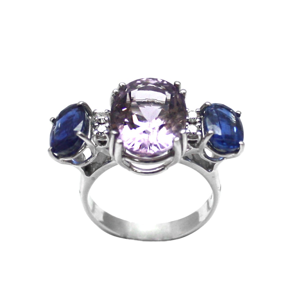 Gold, amethyst, cyanite and diamond ring; 8 gr.: Unusual textural combination for this 18 kt white gold trilogy ring with 5.93 ct amethyst; 3.43 ct cyanite and 0.15 ct diamond. Bold colors and great character! Our company's certification is availabl