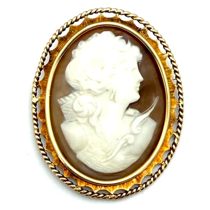 Delightful 18K Yellow Gold Vintage Hand-Carved Cameo Pendant-Brooch with Ornate Frame -17.43g: Delightful 18K yellow gold vintage pendant-brooch featuring a finely hand-carved cameo of a noble lady on sardonyx shell, set in an intricate artisanal frame with detailed corded border. A charmingly