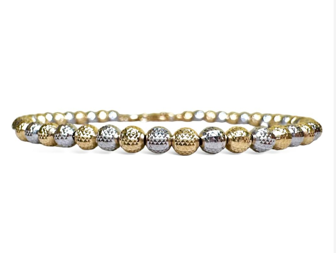 Wonderful 18k solid gold Spheres (diamond effect) Bracelet: Wonderful 18k solid gold Spheres (diamond effect) Bracelet Made in Italy weight: gr 4.0 SKU: PBG Our company's certification is available for free, upon request If you wish to receive any other intern