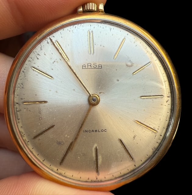 ARSA Gold plated Pocket watch: ARSA Gold plated Pocket watch The watch comes as you can see thru the pictures Case: 44x44mm crown excluded Perfectly working SKU: 23w Swiss Made Rare collection Timepiece